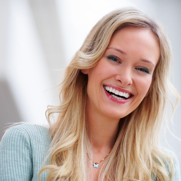 A woman is happily smiling