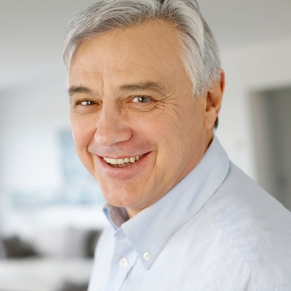 Elderly man is smiling