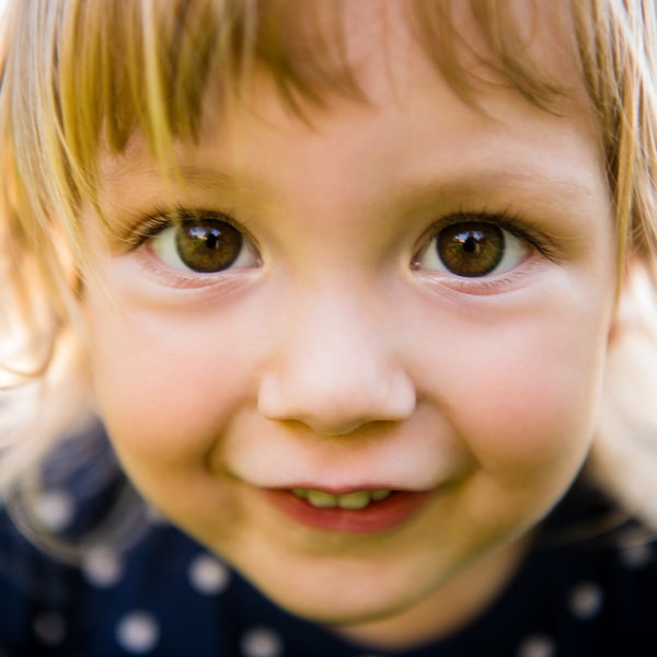 Little girl smiling at the camera