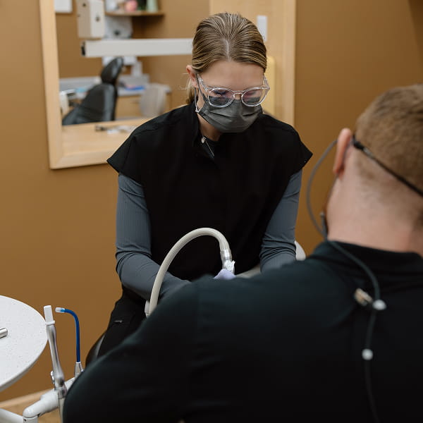 Dentists working with a patient