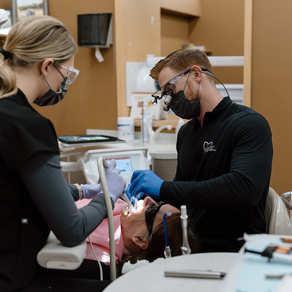 Dentists working with patient at Luverne Dentistry